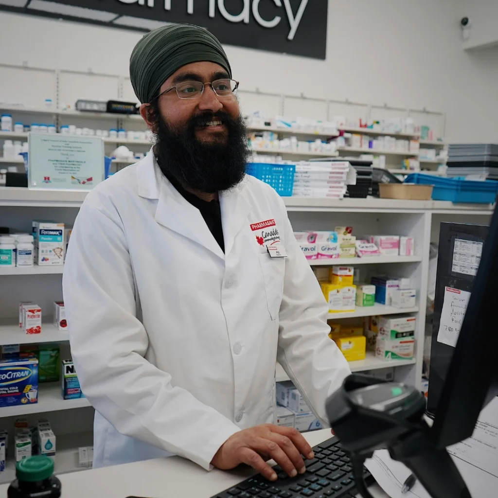 Pharmacist standing at a medical store counter ready to deliver medicines in Seohara.