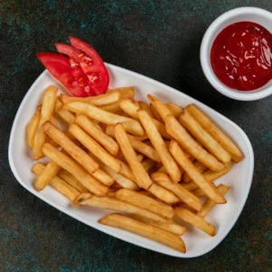 Crispy Salted French Fries served on a white plate with tomato ketchup - Seohara Kitchen