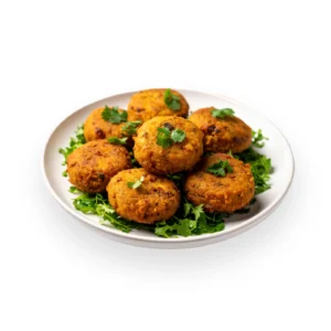 Plate of golden brown Chicken Shami Kebabs served with red chutney and coriander. Best frozen shami kebab delivery in Seohara.