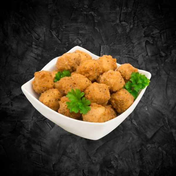 Fried Chicken Popcorn Bowl White square bowl filled with golden fried crispy chicken popcorn on a dark background - Seohara Kitchen