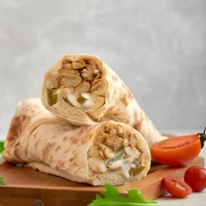 Chicken salami roll cut in half showing pink salami slices and mayo on dark background - Seohara Kitchen