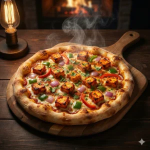 Hot Tandoori Paneer Pizza with marinated paneer cubes, red paprika, and onion capsicum toppings on a fresh dough base.